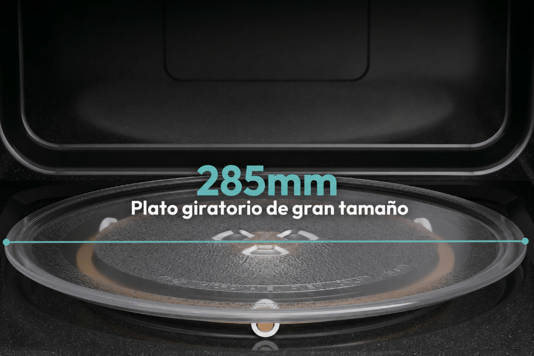 Plato giratorio de microondas de 285 mm dentro de una cavidad oscura.