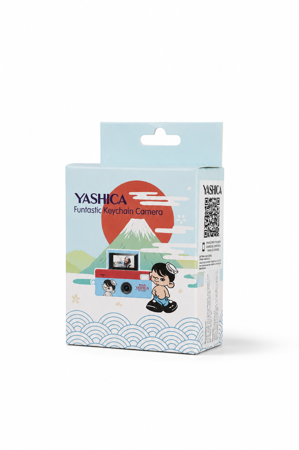 Dağ ve çizgi film grafikleri içeren açık mavi Yashica Funtastic Anahtarlık Kamera kutusu.
