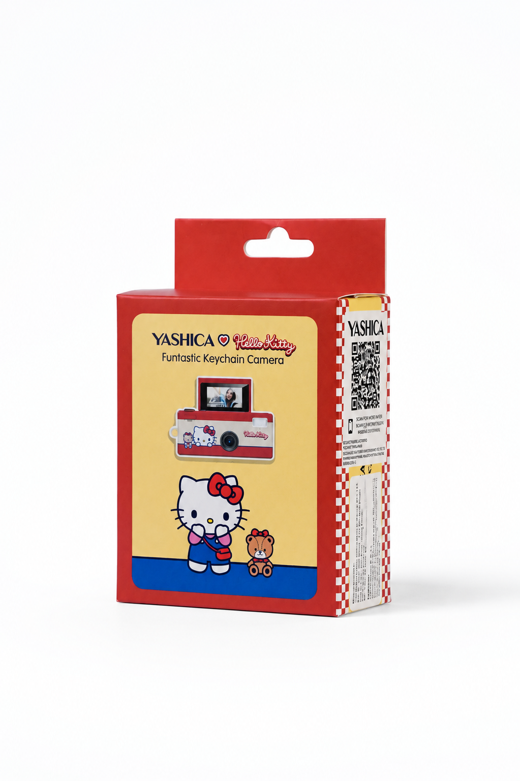 Kırmızı ve sarı renkli Yashica Hello Kitty anahtarlık kamera kutusunda Hello Kitty ve oyuncak ayı var.