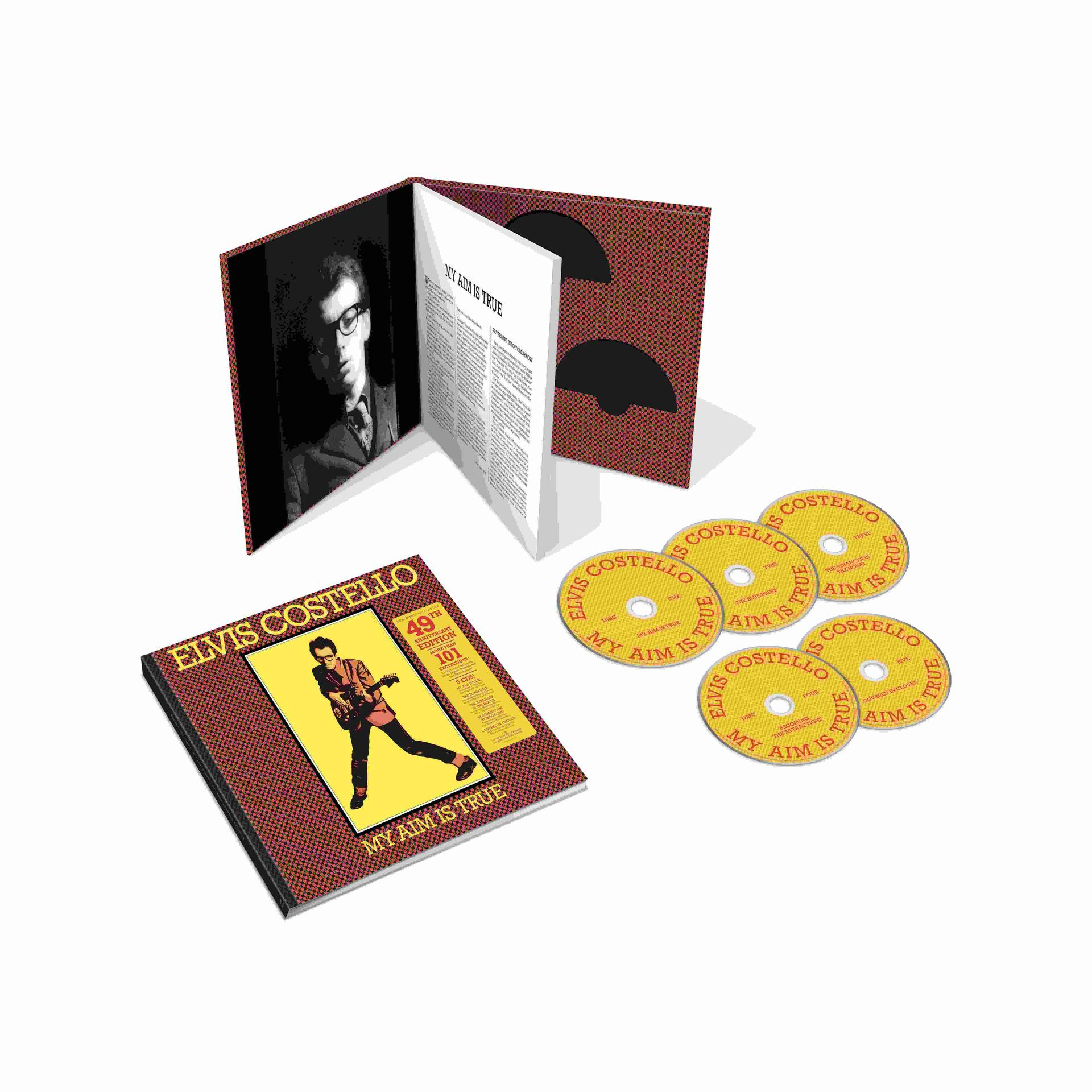 Elvis Costello CD Boxset mit Buch und vier Discs auf weißem Hintergrund.