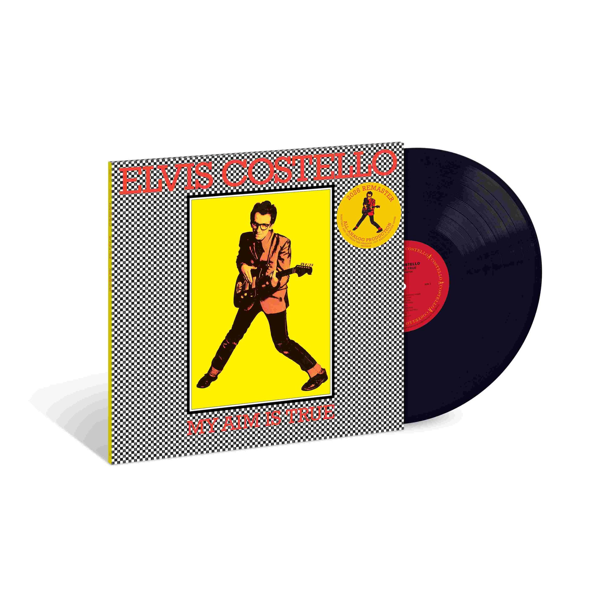 Elvis Costellos Vinyl-Album My Aim Is True zeigt ihn mit Gitarre vor einem gelben und schwarz-weiß karierten Hintergrund.