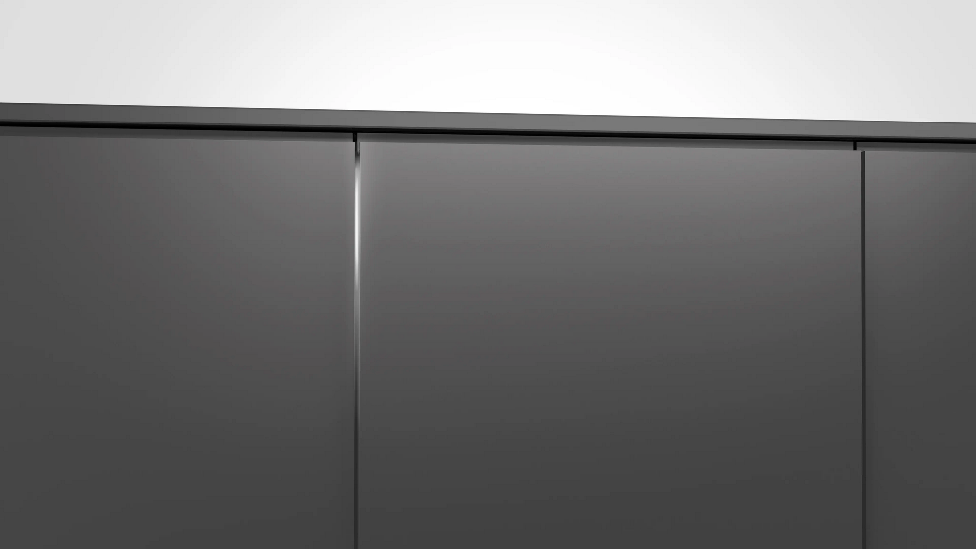 Armarios de cocina modernos en gris oscuro con un diseño elegante sin tiradores y estética minimalista.