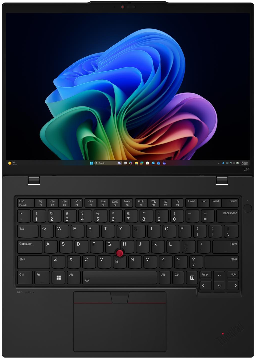 Egy fekete laptop színes, absztrakt hullámos háttérképpel és látható QWERTY billentyűzettel.