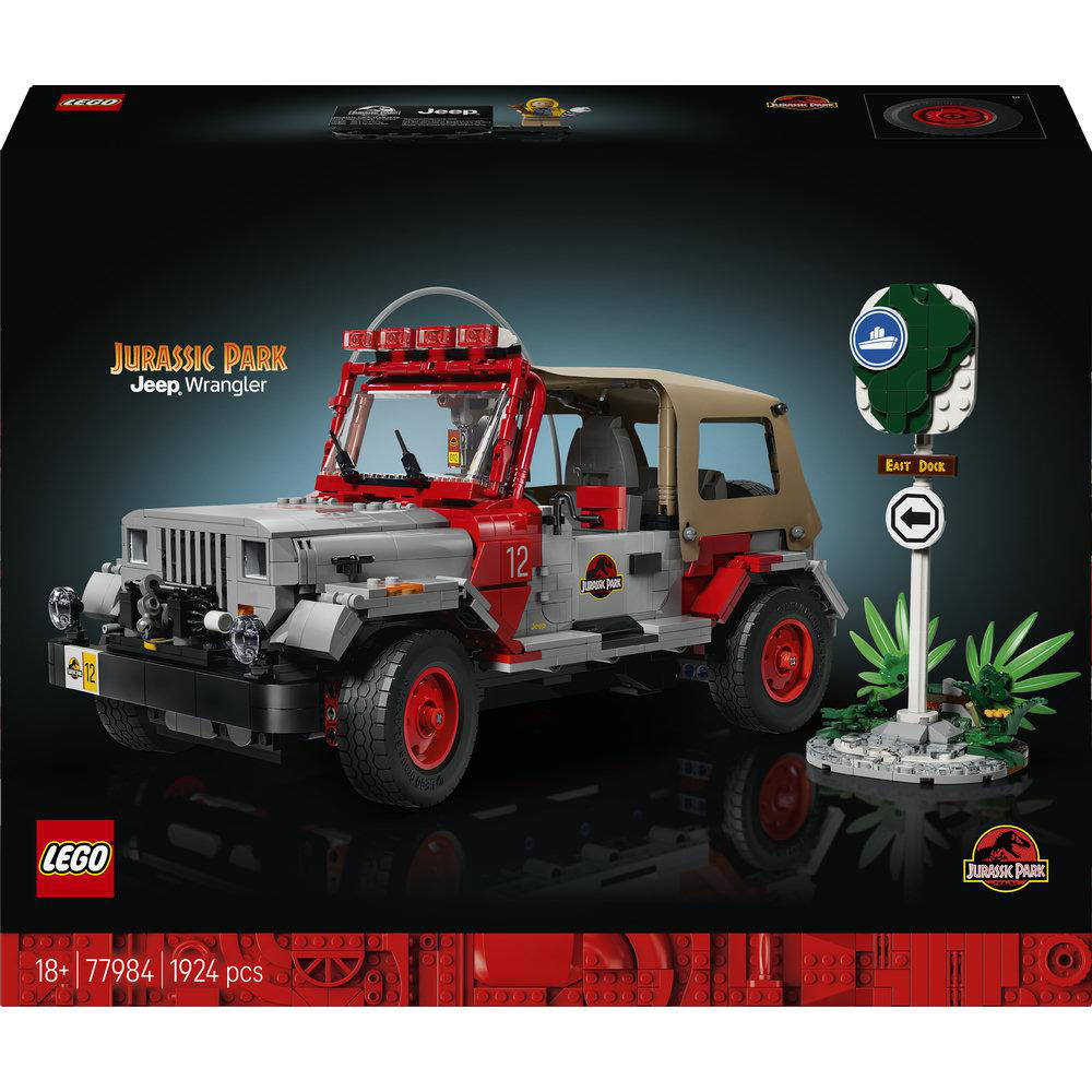 Lego Jurassic Park Jeep Wrangler Set mit rotem und grauem Auto, Schild und Dschungelpflanzen.