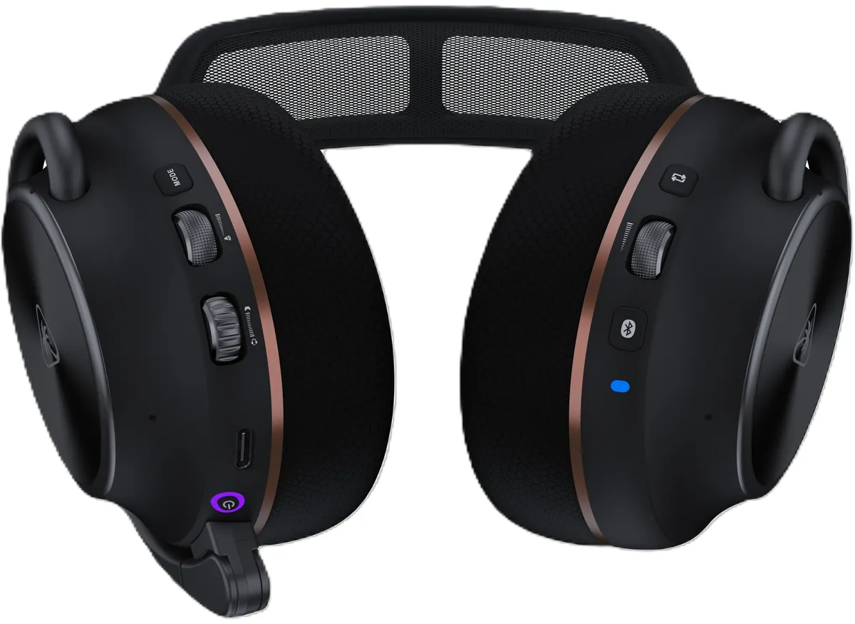 Cuffie da gioco wireless nere con dettagli in oro rosa, rotelle di controllo, un microfono e pulsante di accensione.