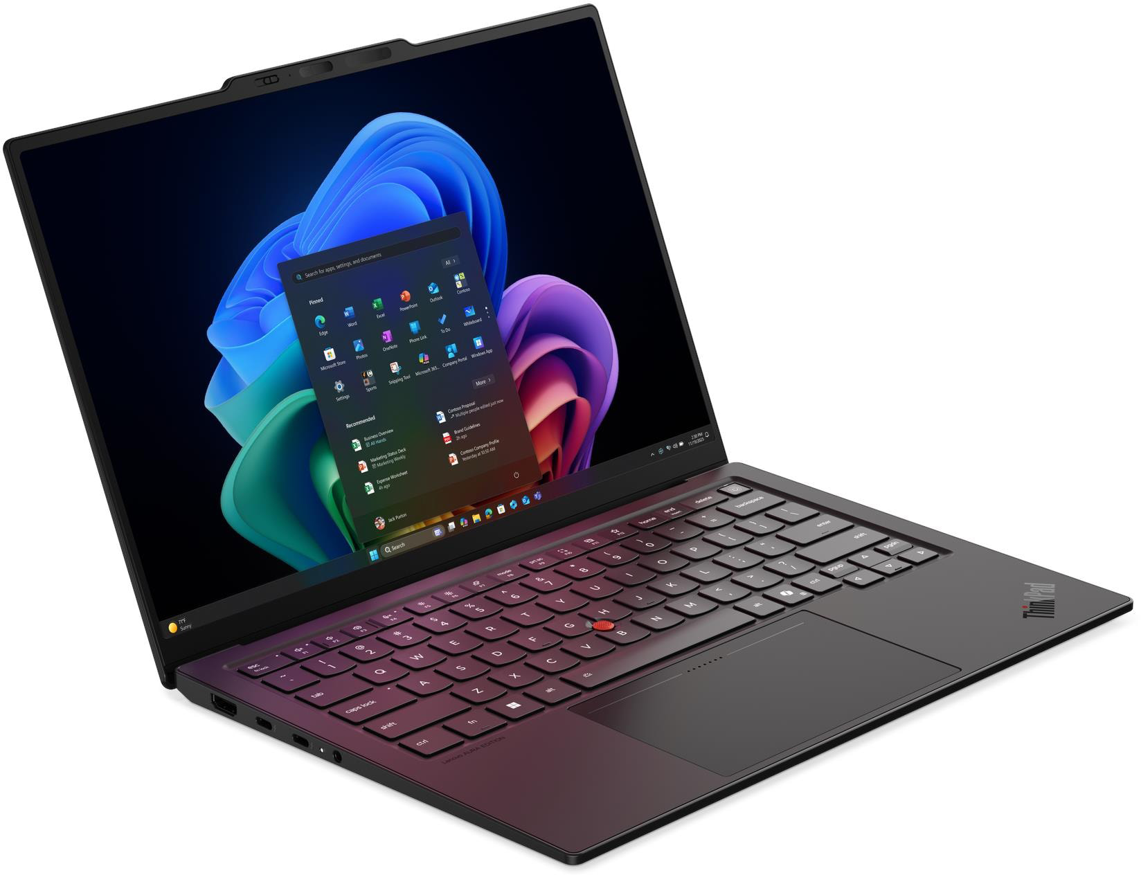 Egy fekete laptop Windows 11 képernyővel és vöröses árnyalatú billentyűzettel.