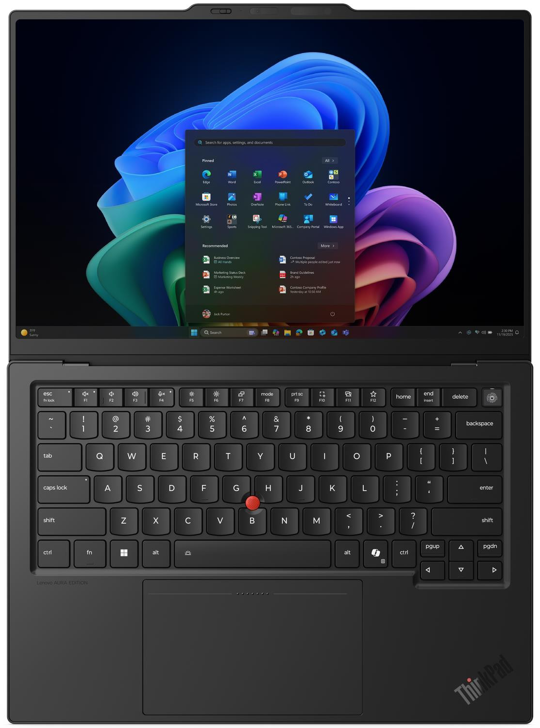 Fekete laptop Windows Start menüvel a színes képernyőn és háttérvilágítású billentyűzettel.