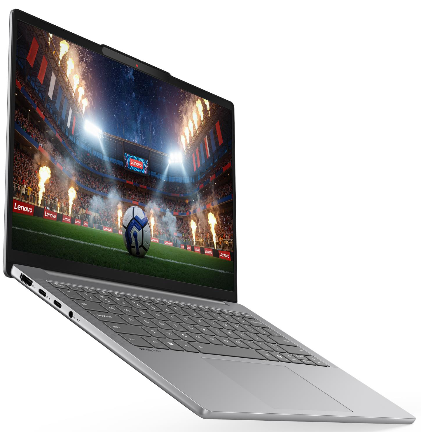 Egy ezüstszínű laptop képernyőjén egy fényesen kivilágított stadion látható.