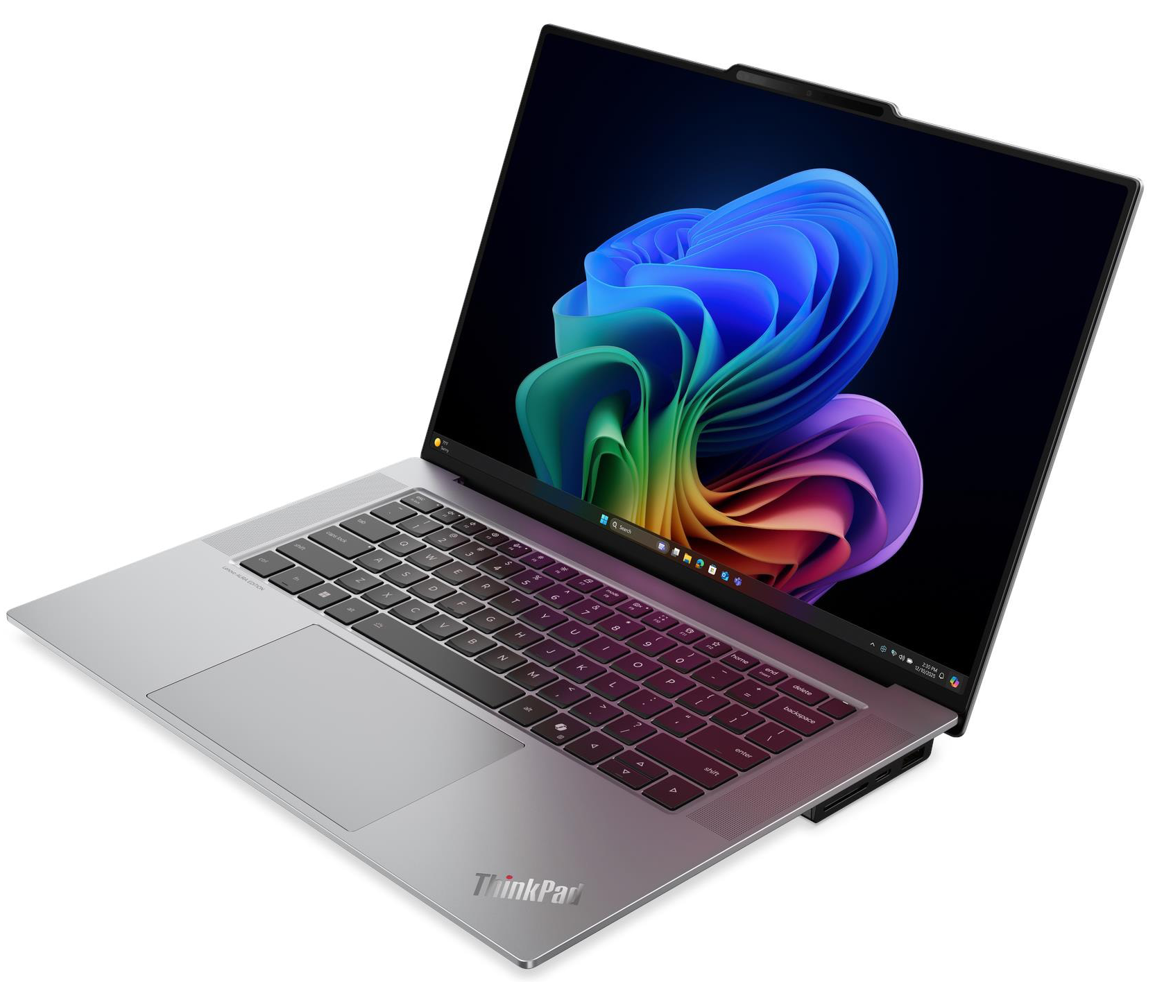 Ezüst ThinkPad laptop színes absztrakt háttérképpel a képernyőn.