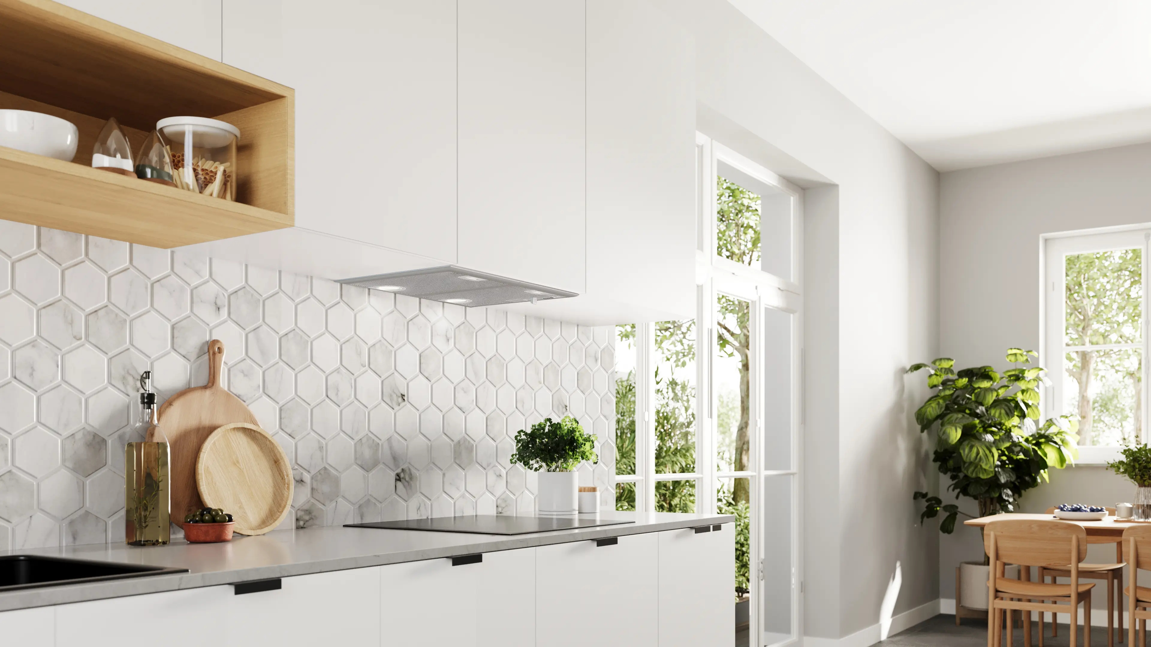 Cocina blanca moderna con azulejos de mármol, detalles en madera y comedor junto a una ventana.