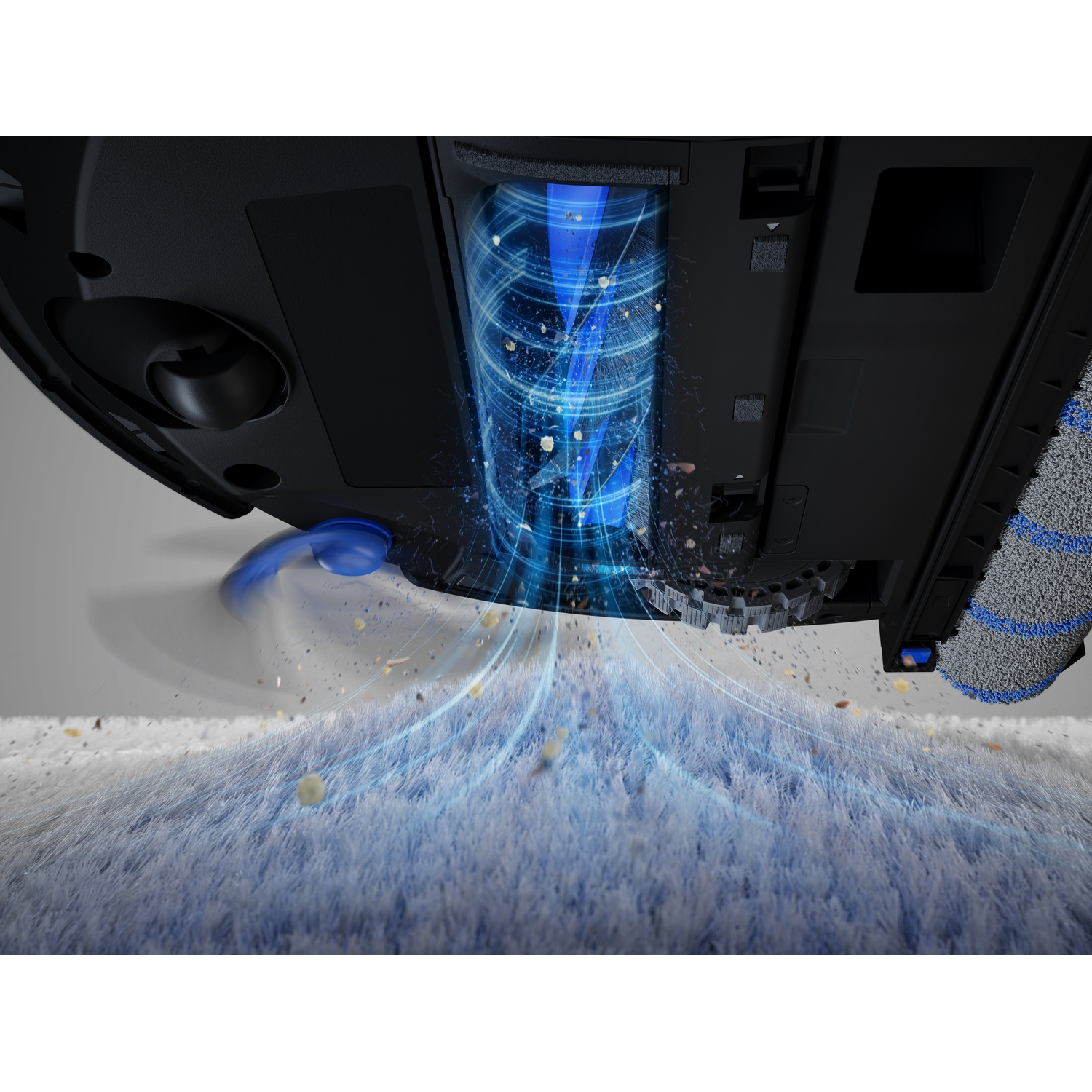 Parte inferiore di un robot aspirapolvere con aspirazione blu che rimuove polvere da un tappeto.