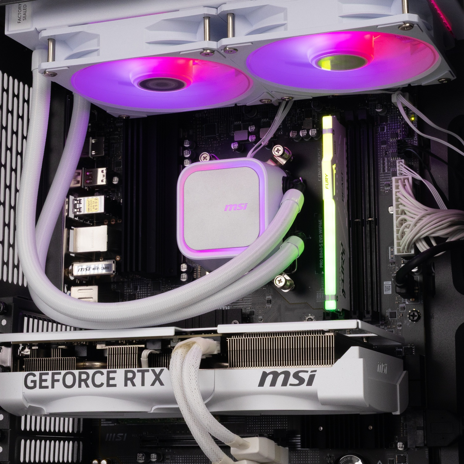 Inside a PC with an MSI GeForce RTX graphics card, glowing liquid cooling, and RAM in a black chassis.