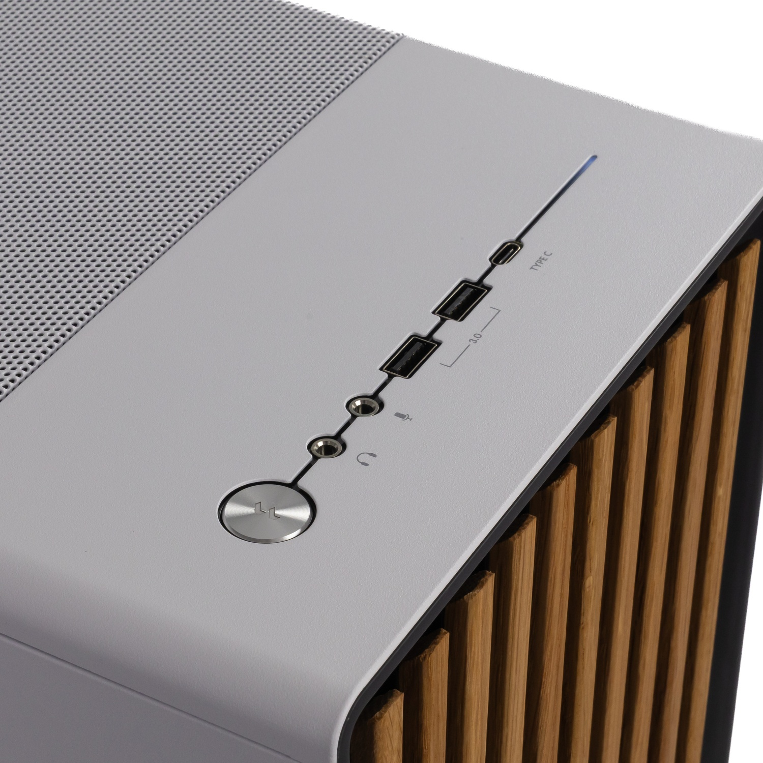 Top panel of a gray PC case with ports, power button, and vertical wooden slats.
