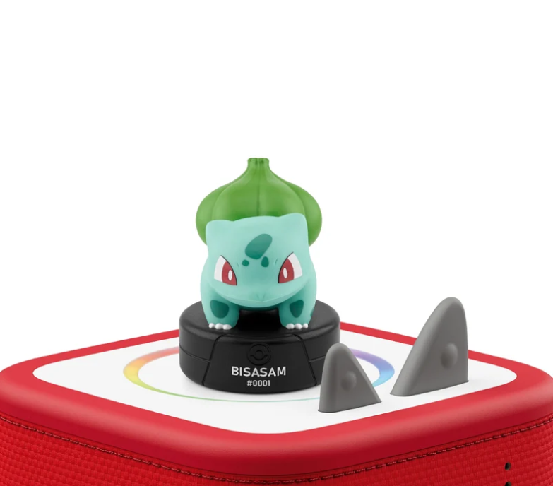 Eine Bisasam-Figur auf einem roten Toniebox-Gerät mit bunten Farbkreis.