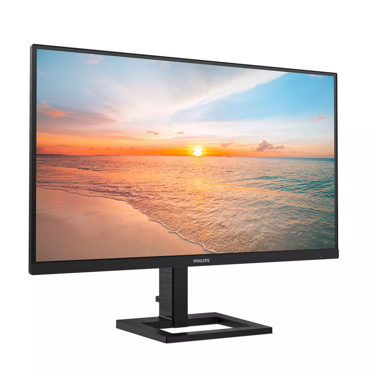 Ein schwarzer Philips Monitor zeigt ein lebendiges Bild von einem Sonnenuntergang über einem sandigen Strand am Meer.
