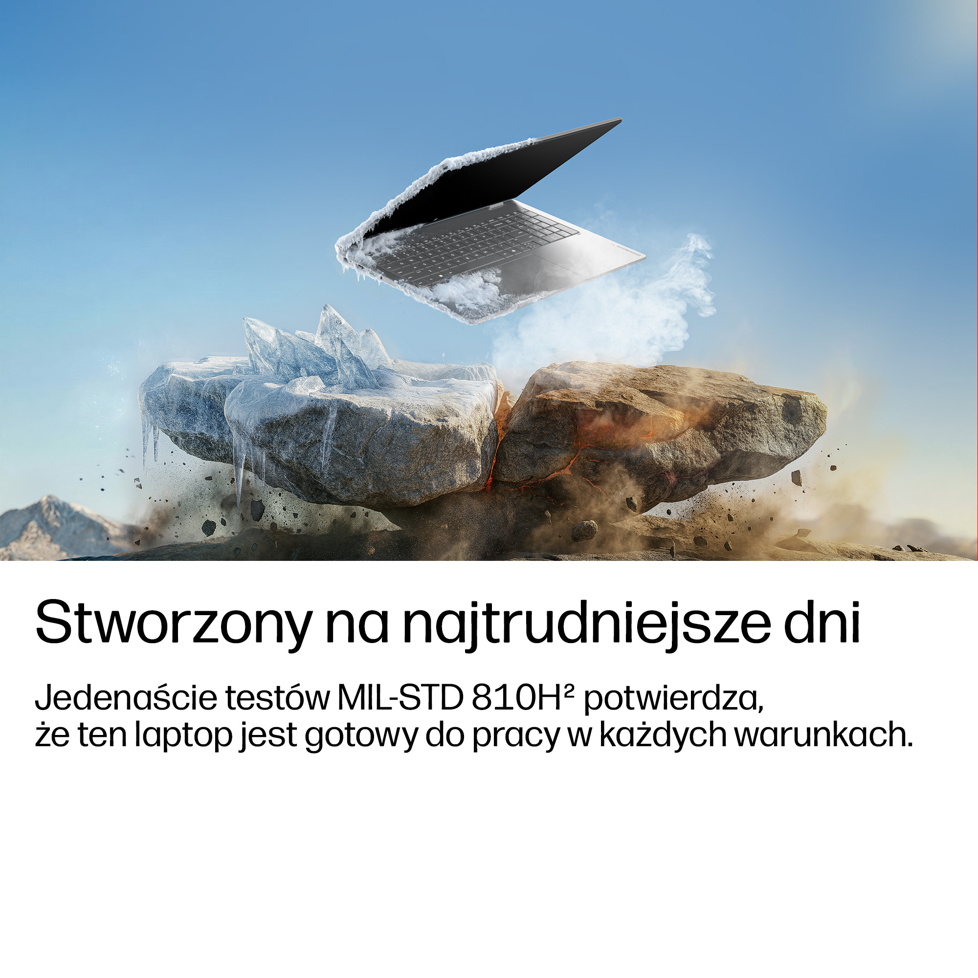 Zimny laptop unosi się nad pękniętą skałą z lodu i kamienia pod błękitnym niebem.