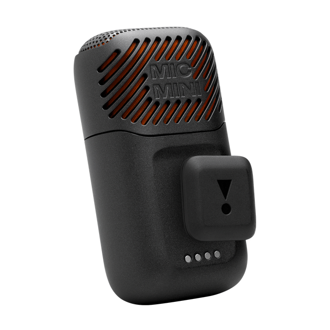 Un dispositivo Mic Mini negro con detalles de rejilla naranja y un clip JBL adjunto sobre fondo negro.
