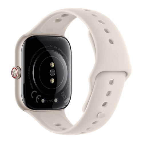 Vista trasera de un reloj inteligente beige con correa de silicona perforada y sensores.