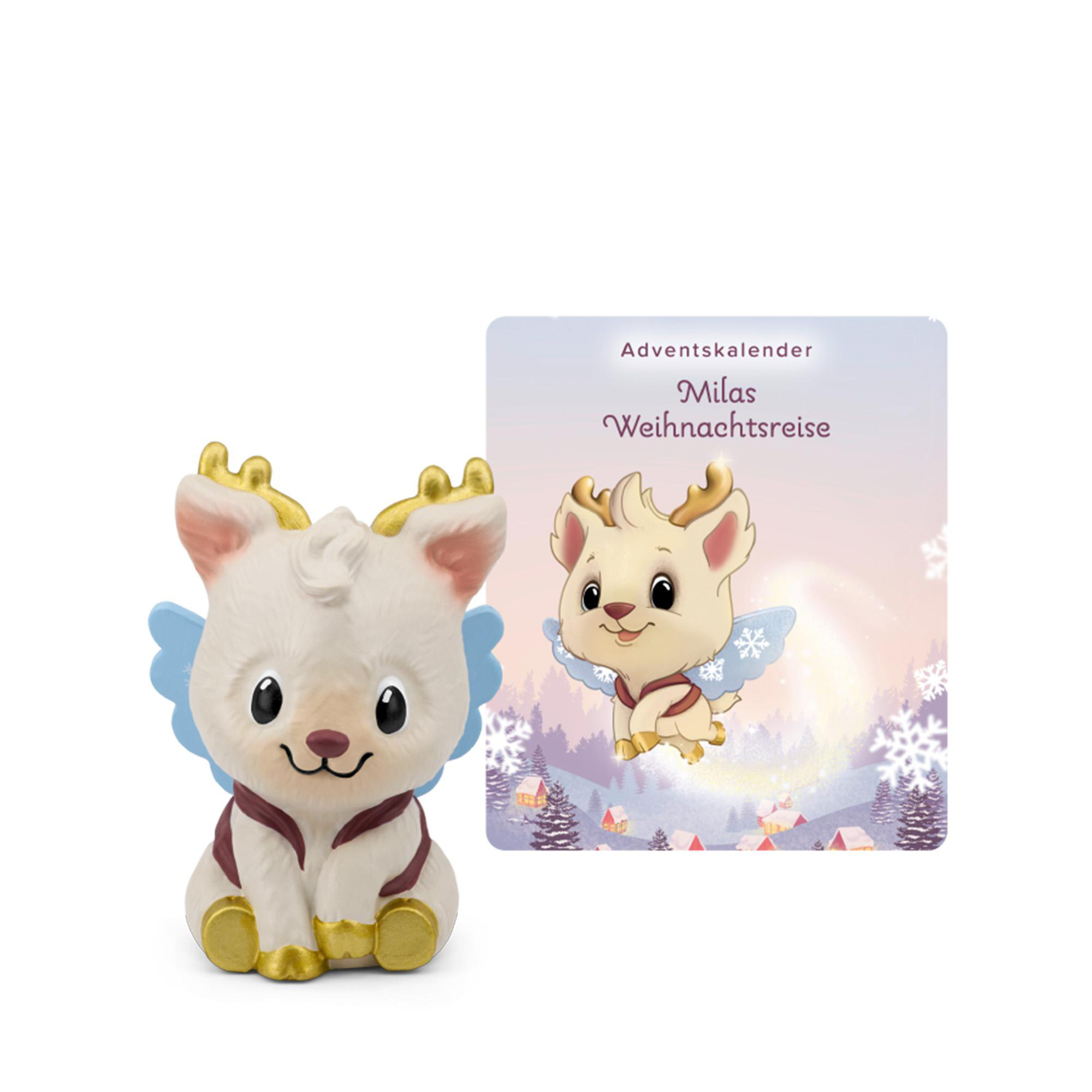 Eine kleine weiße Rentierfigur mit goldenen Hörnern und blauen Flügeln neben einer Adventskarte.