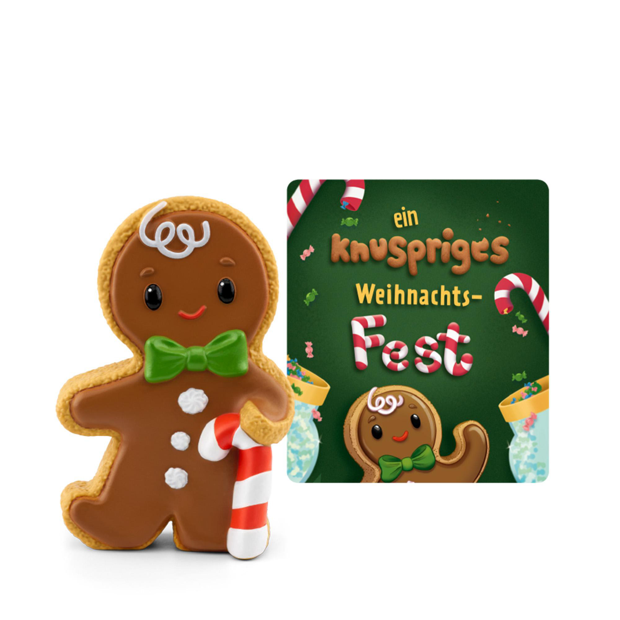 Ein Lebkuchenmann mit grüner Schleife und Zuckerstange neben einem Buch mit dem Titel Ein knuspriges Weihnachts-Fest.