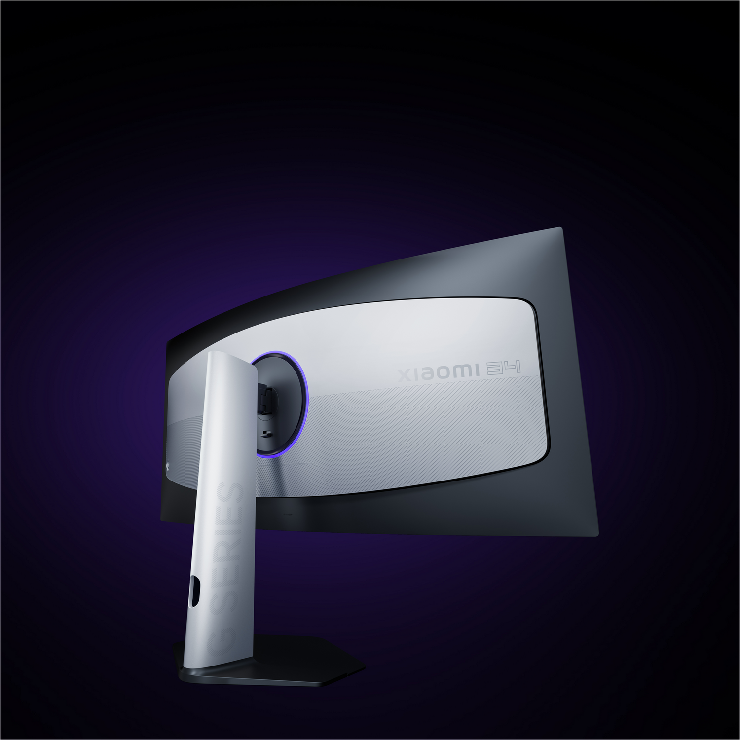 Vista trasera de un monitor curvo Xiaomi para juegos con soporte blanco sobre fondo oscuro.