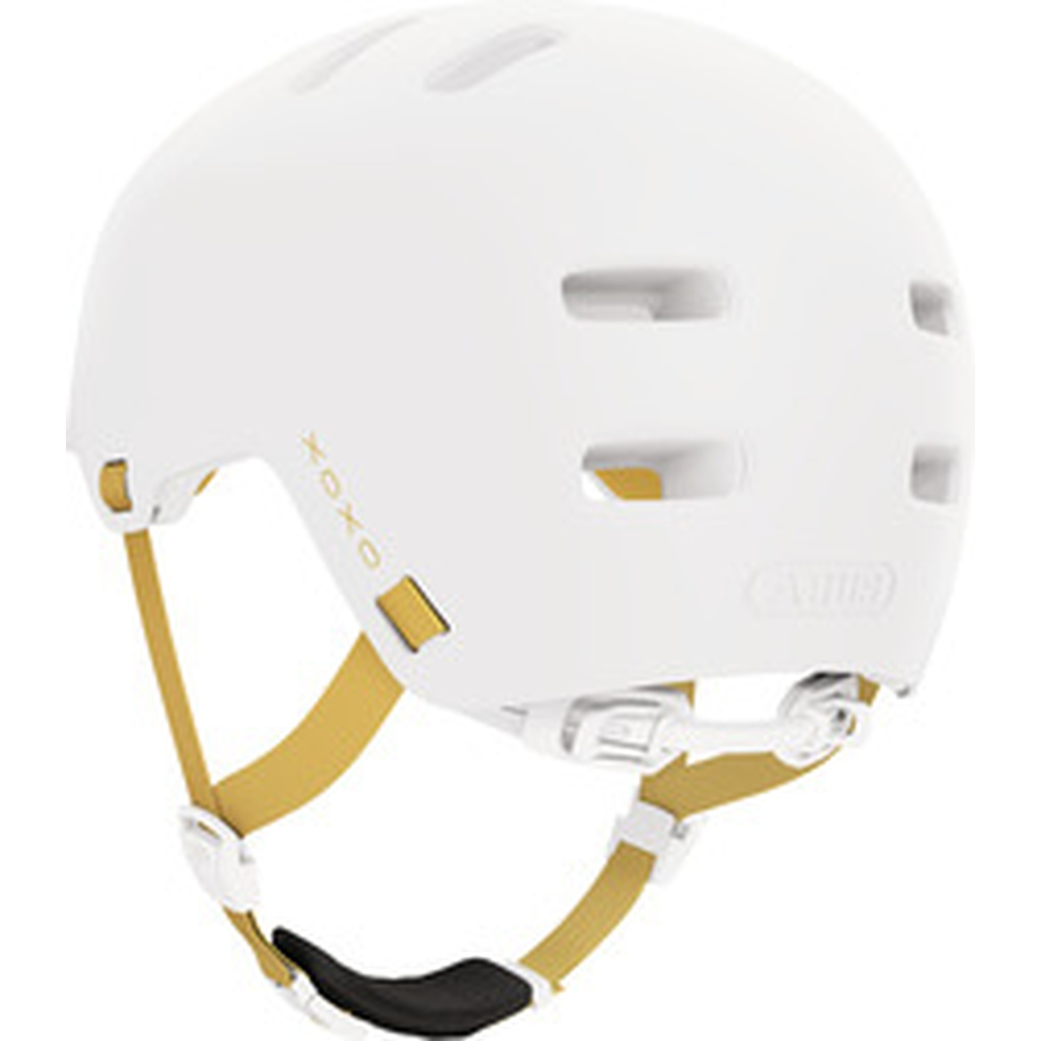 A white bicycle helmet with gold straps and ventilation slots against a white background.