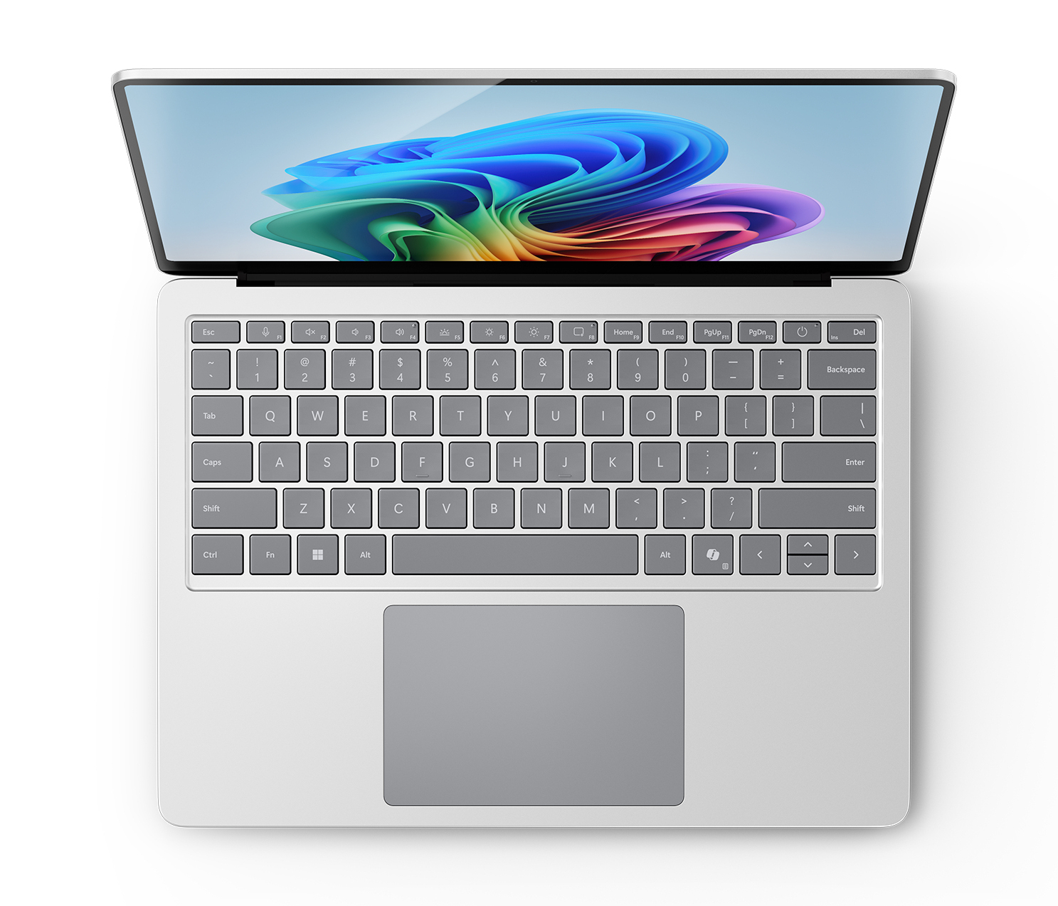 Top-down-Ansicht eines silbernen Laptops mit bunter Bildschirmgrafik und Tastatur.