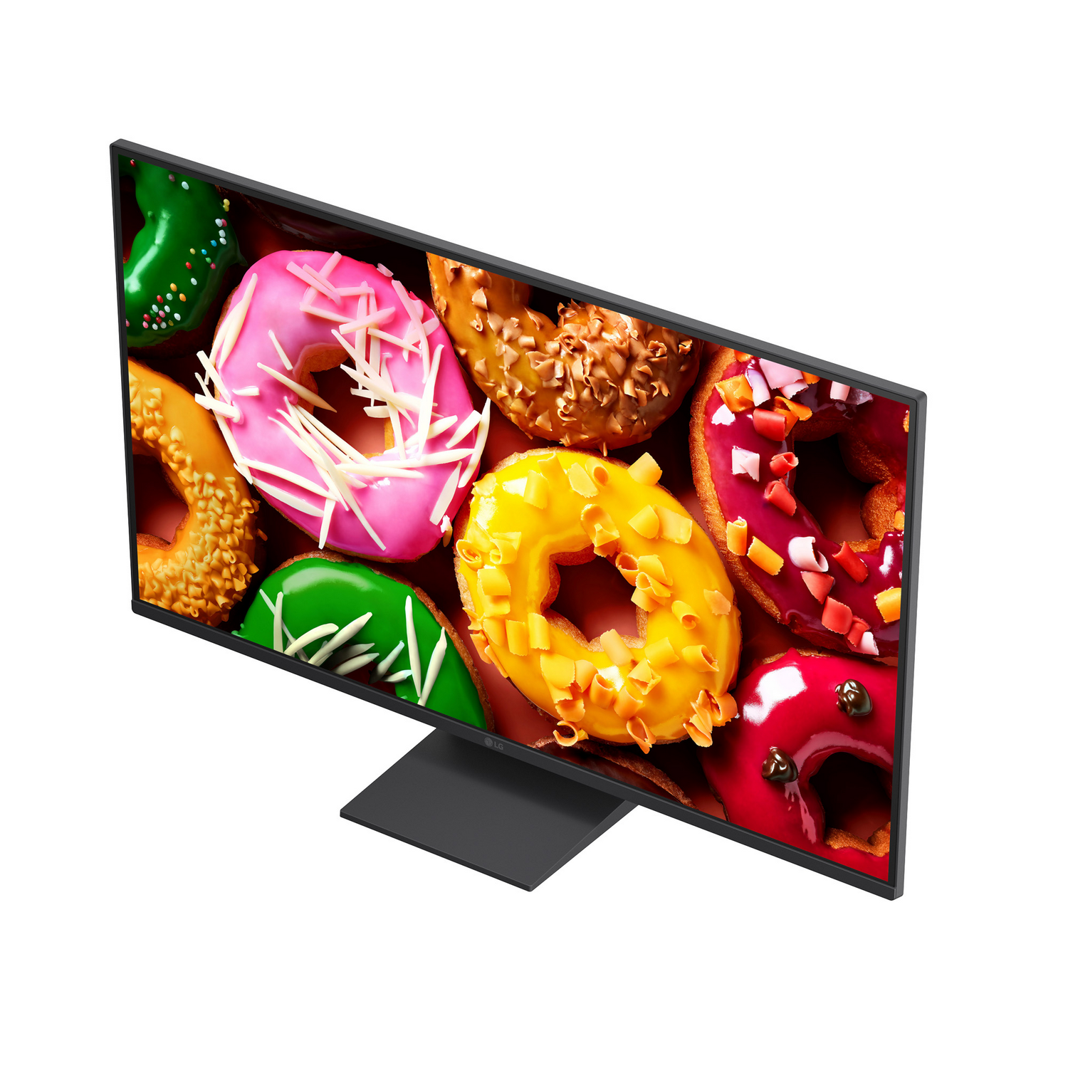 Un monitor negro muestra una imagen vibrante de coloridos donuts glaseados y con chispas.