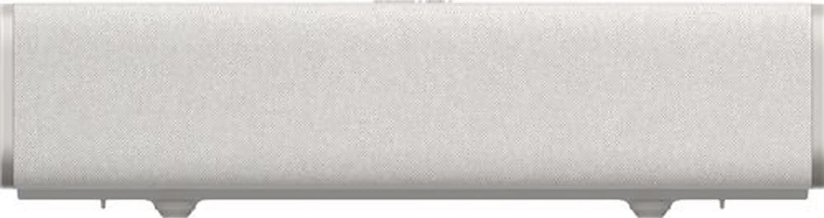 Un haut-parleur blanc avec des bords gris et un revêtement en tissu sur une surface plane.