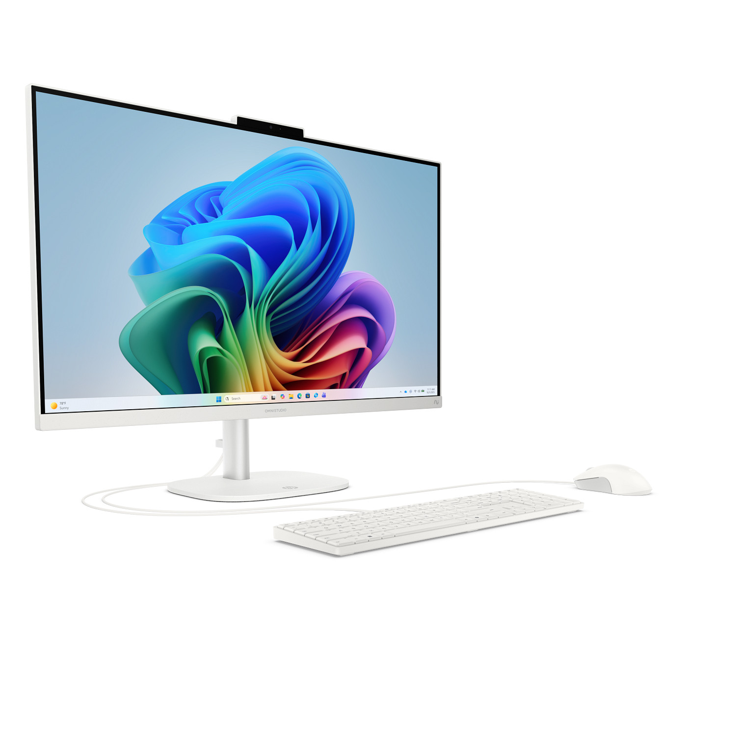 Un ordenador todo en uno blanco con un gráfico abstracto colorido en la pantalla, acompañado de teclado y ratón.