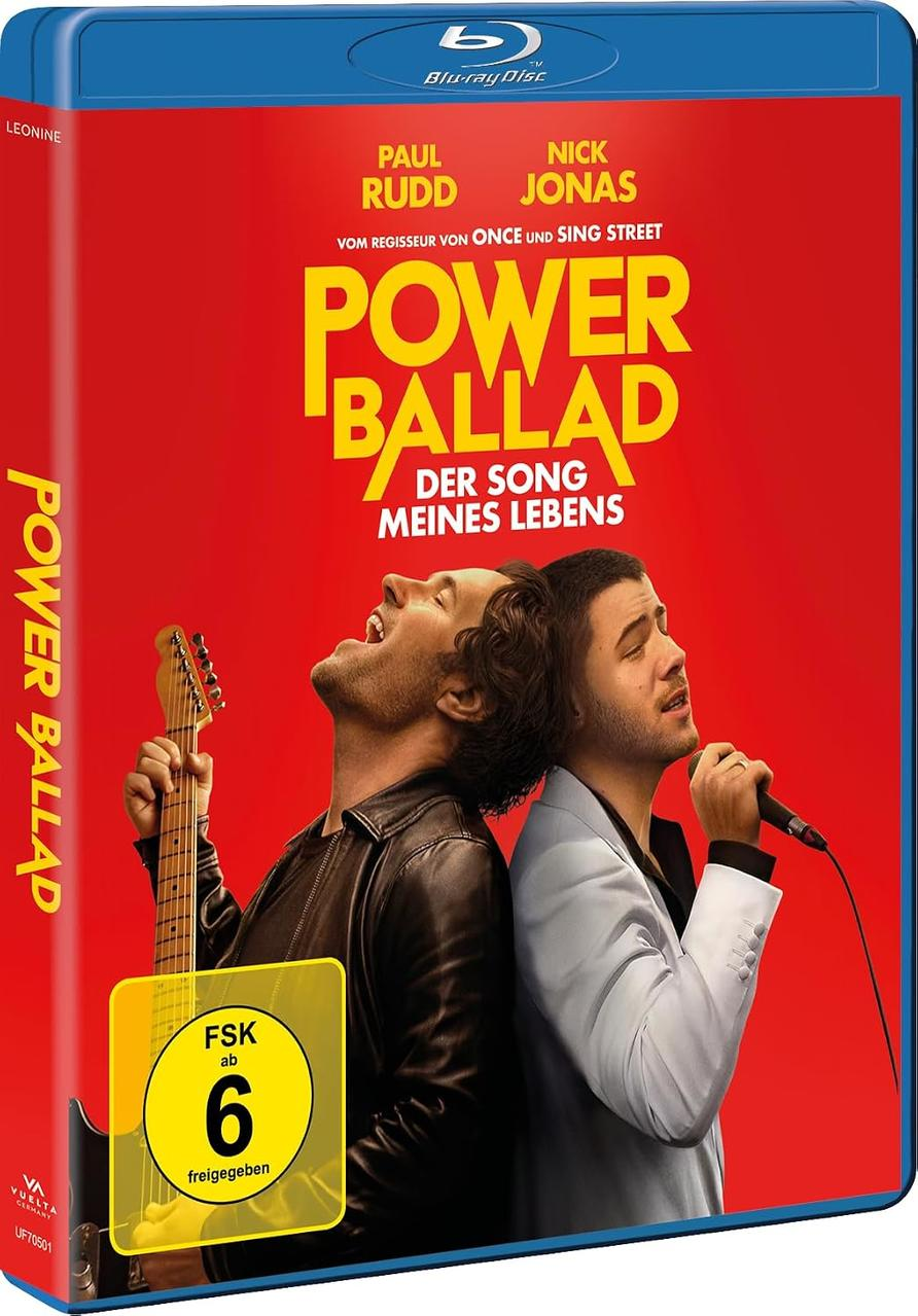 Blu-ray-Cover für Power Ballad mit Paul Rudd und Nick Jonas vor rotem Hintergrund.