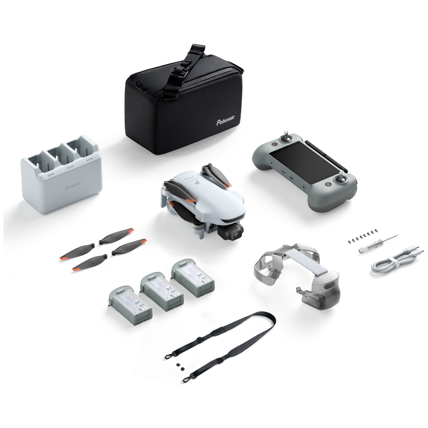 Un drone gris avec télécommande, batteries, étui de transport et accessoires sur fond blanc.
