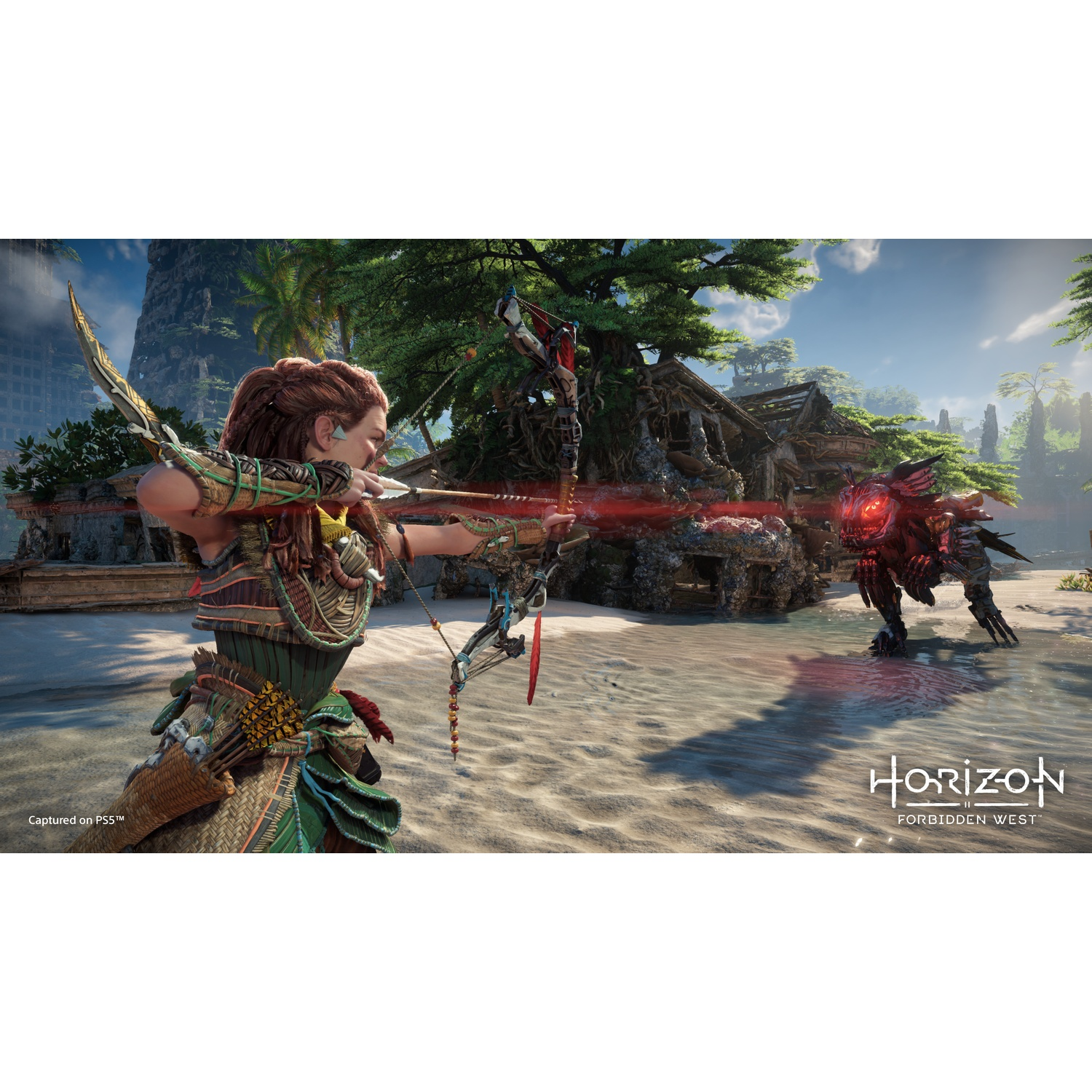 Aloy richt een pijl en boog op een mechanisch monster op een strand.