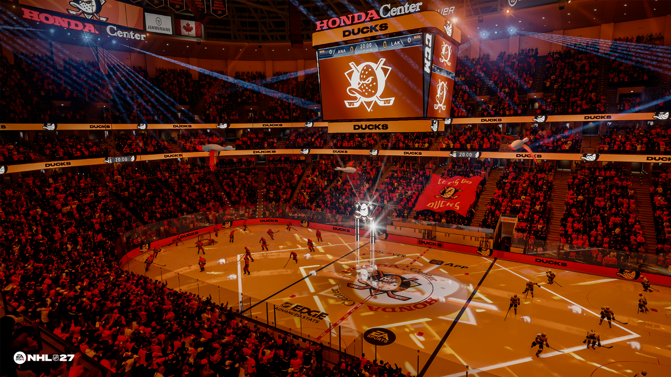 Mecz hokejowy w Honda Center, oświetlony pomarańczowym światłem, pełen kibiców.