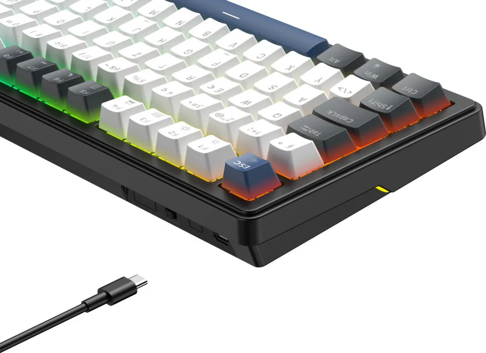Clavier mécanique avec touches blanches et noires, rétroéclairage RVB et câble USB-C.