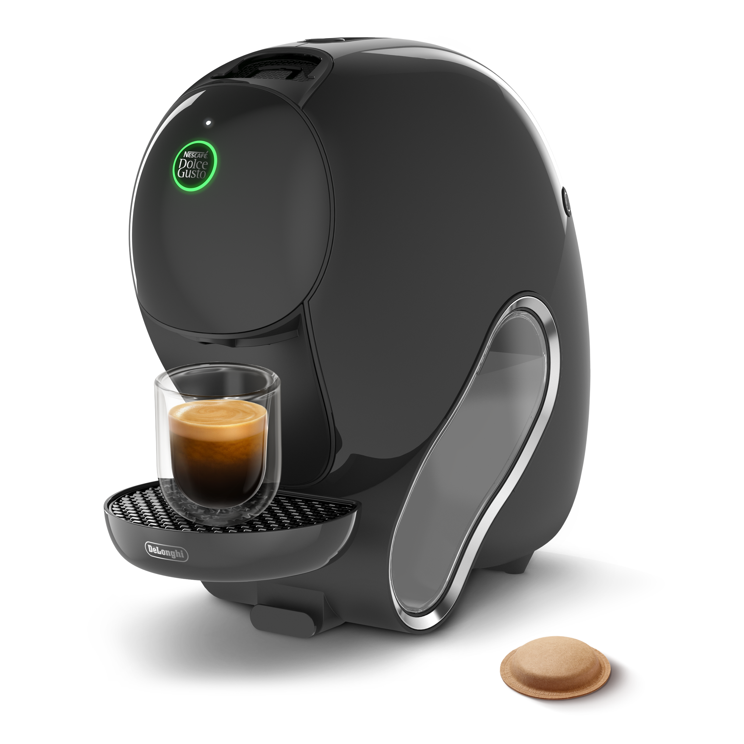 Cafetera negra DeLonghi con una taza de espresso de cristal y una cápsula sobre fondo negro.