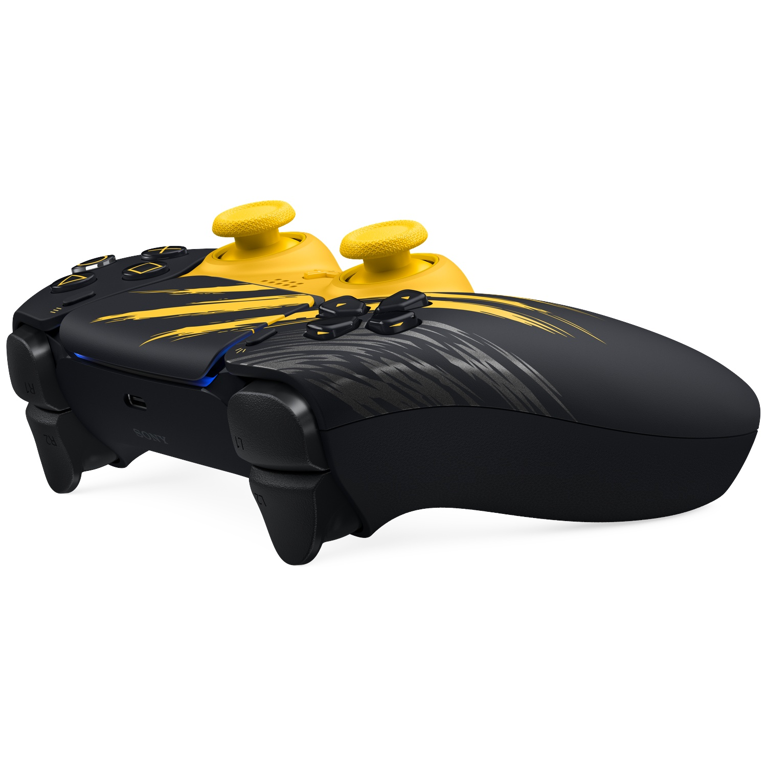 Een zwarte en gele PlayStation-controller met gele sticks en dynamische penseelstreekpatronen.
