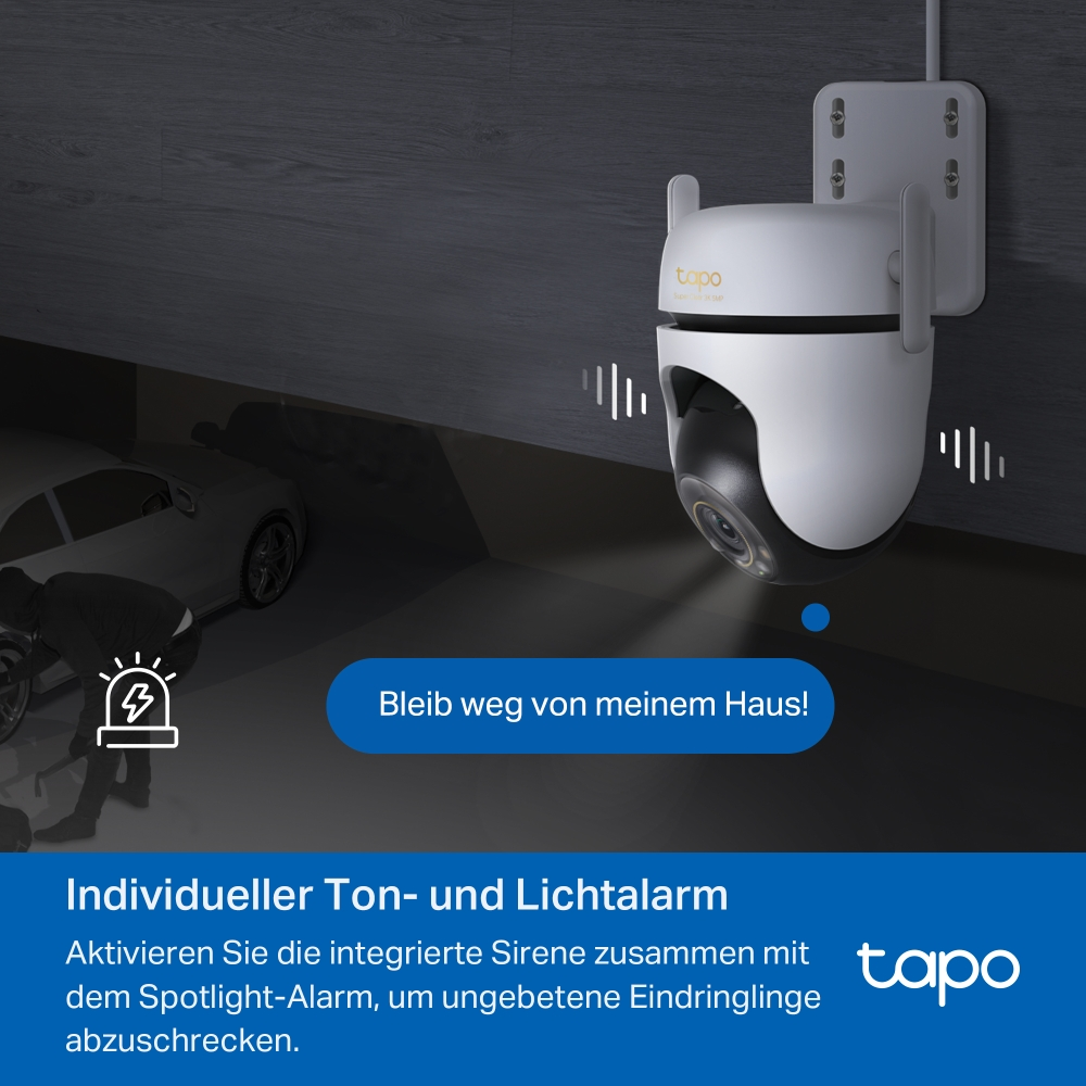 Wandmontierte weiße Überwachungskamera in einer dunklen Garage mit Auto und Textfeld für Alarm.