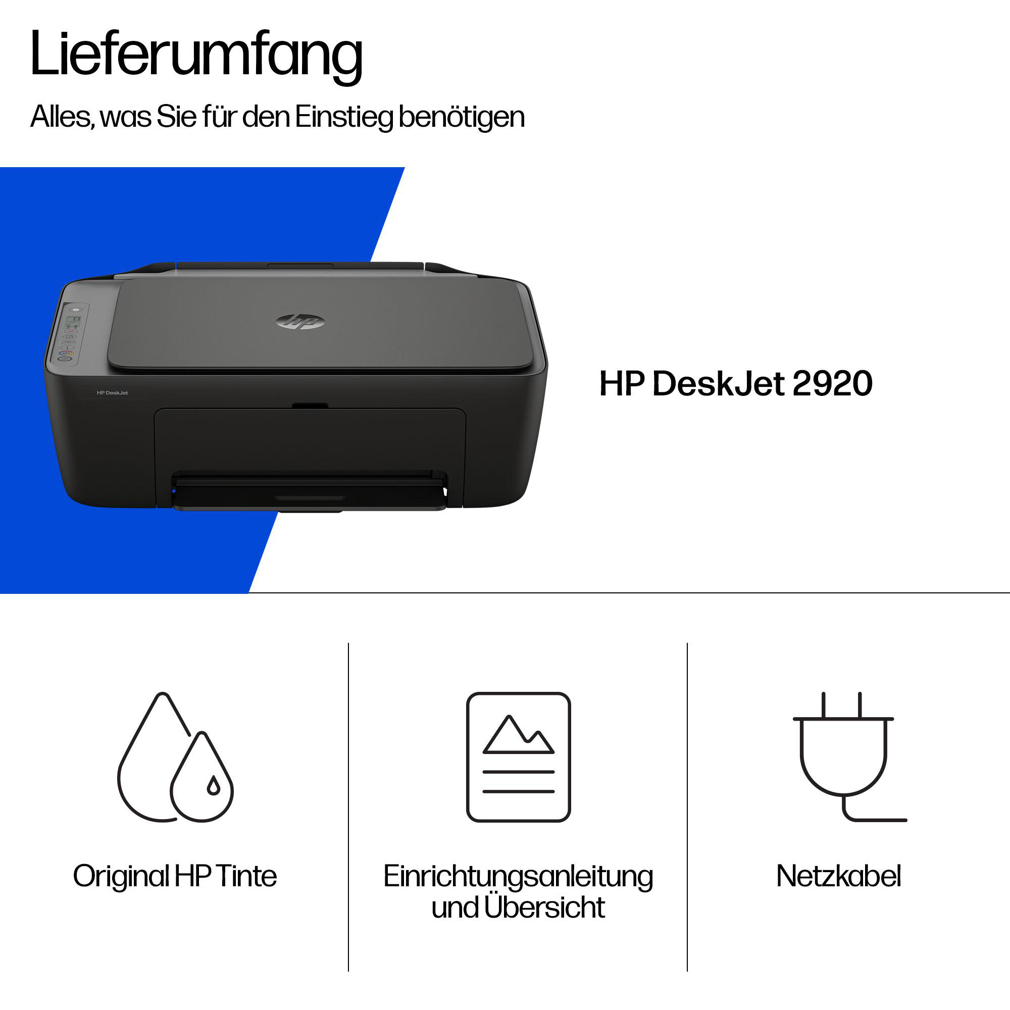 HP DeskJet 2920 Drucker und mitgeliefertes Zubehör wie Tinte, Anleitung und Netzkabel.
