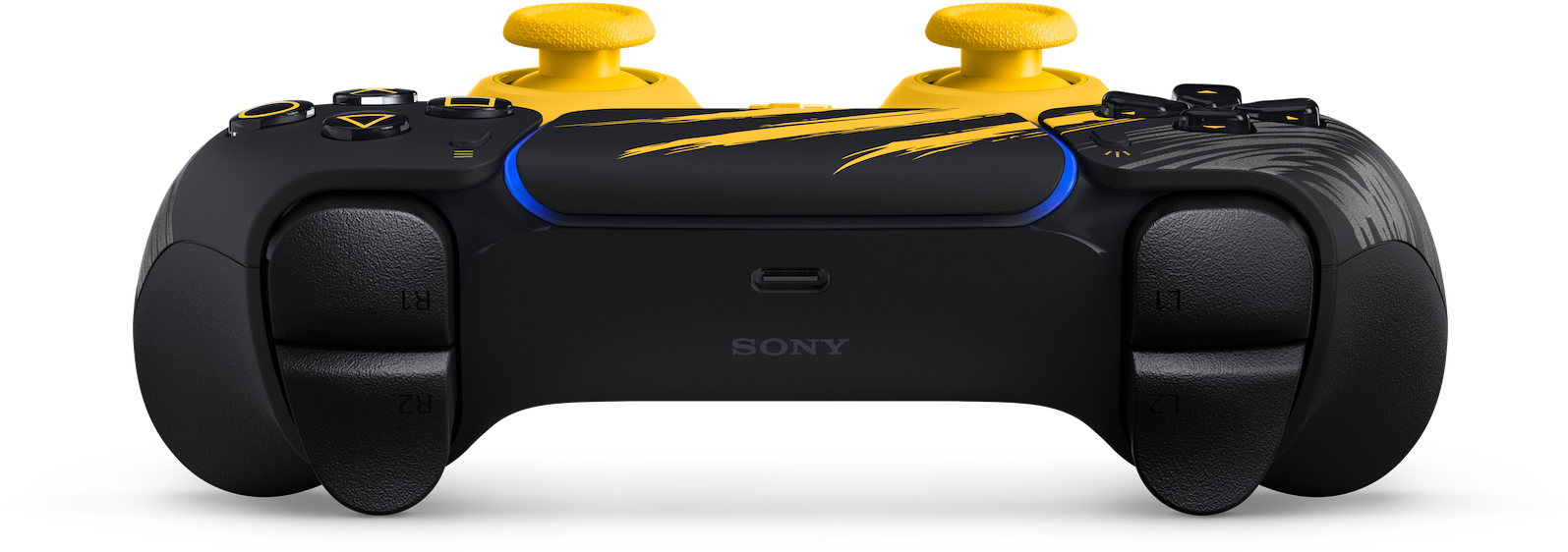 Ein schwarz-gelber PlayStation-Controller mit gelben Joysticks und Zierstreifen auf schwarzem Hintergrund.