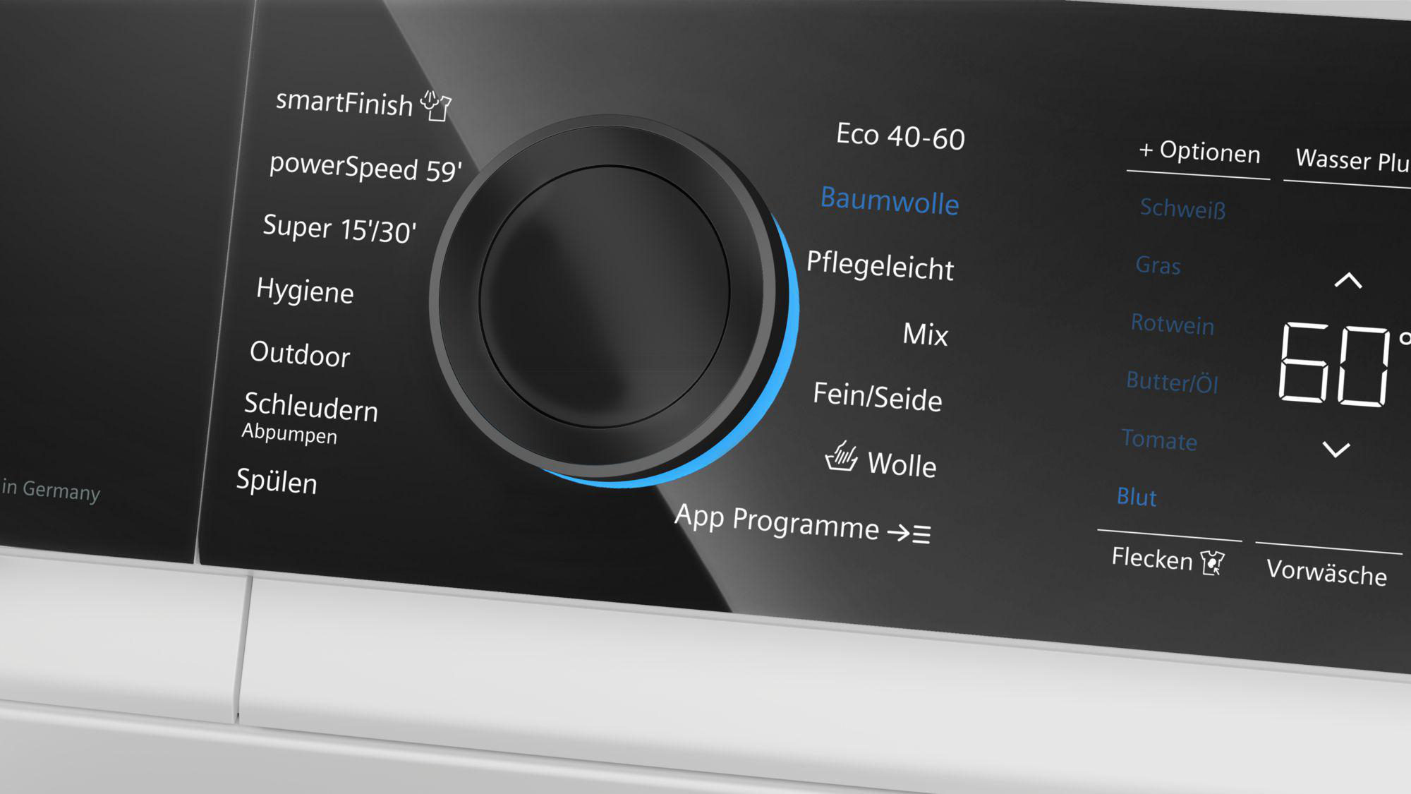 Bedienfeld einer Waschmaschine mit Drehknopf und digitalem Display.