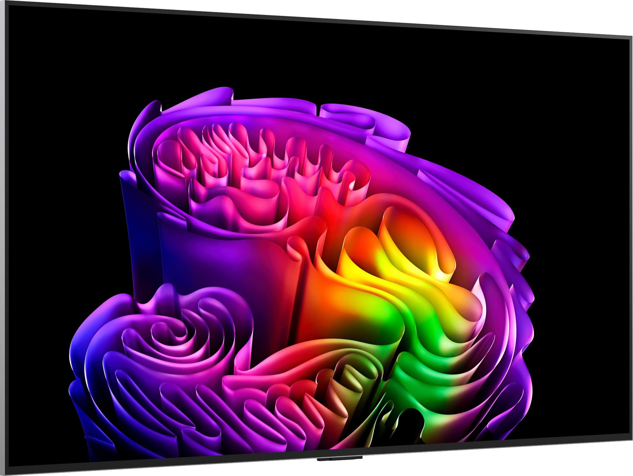 Ein Fernseher zeigt eine bunte, abstrakte Form mit violetten, roten, gelben und grünen Farben auf schwarzem Grund.