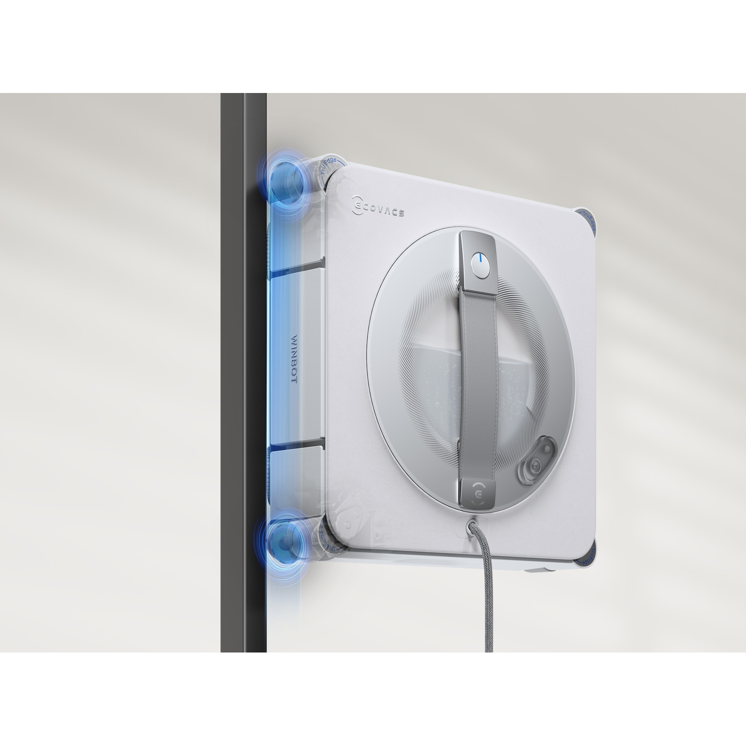 Un robot pulisci vetri bianco Ecovacs Winbot pulisce una parete di vetro con luce blu sui bordi.