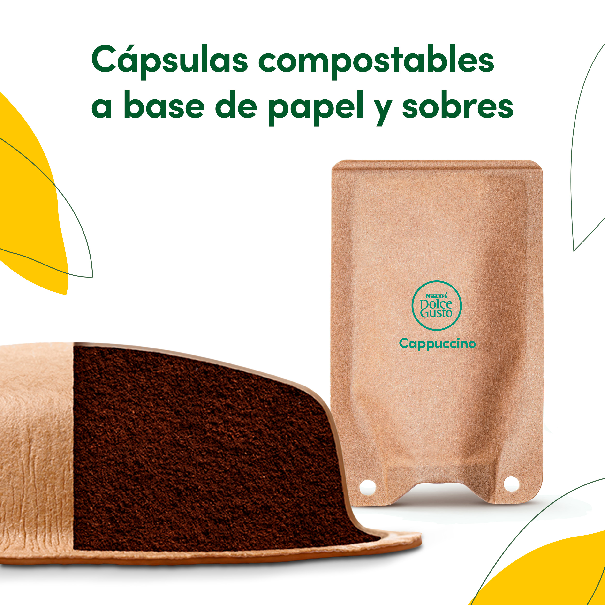 Cápsulas de café de papel y sobres con café molido, rodeados de hojas verdes y amarillas.