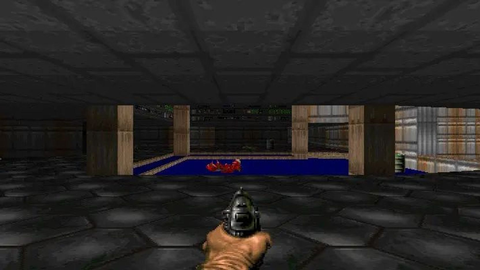Una mano sostiene un arma en un videojuego oscuro y pixelado con un charco azul.