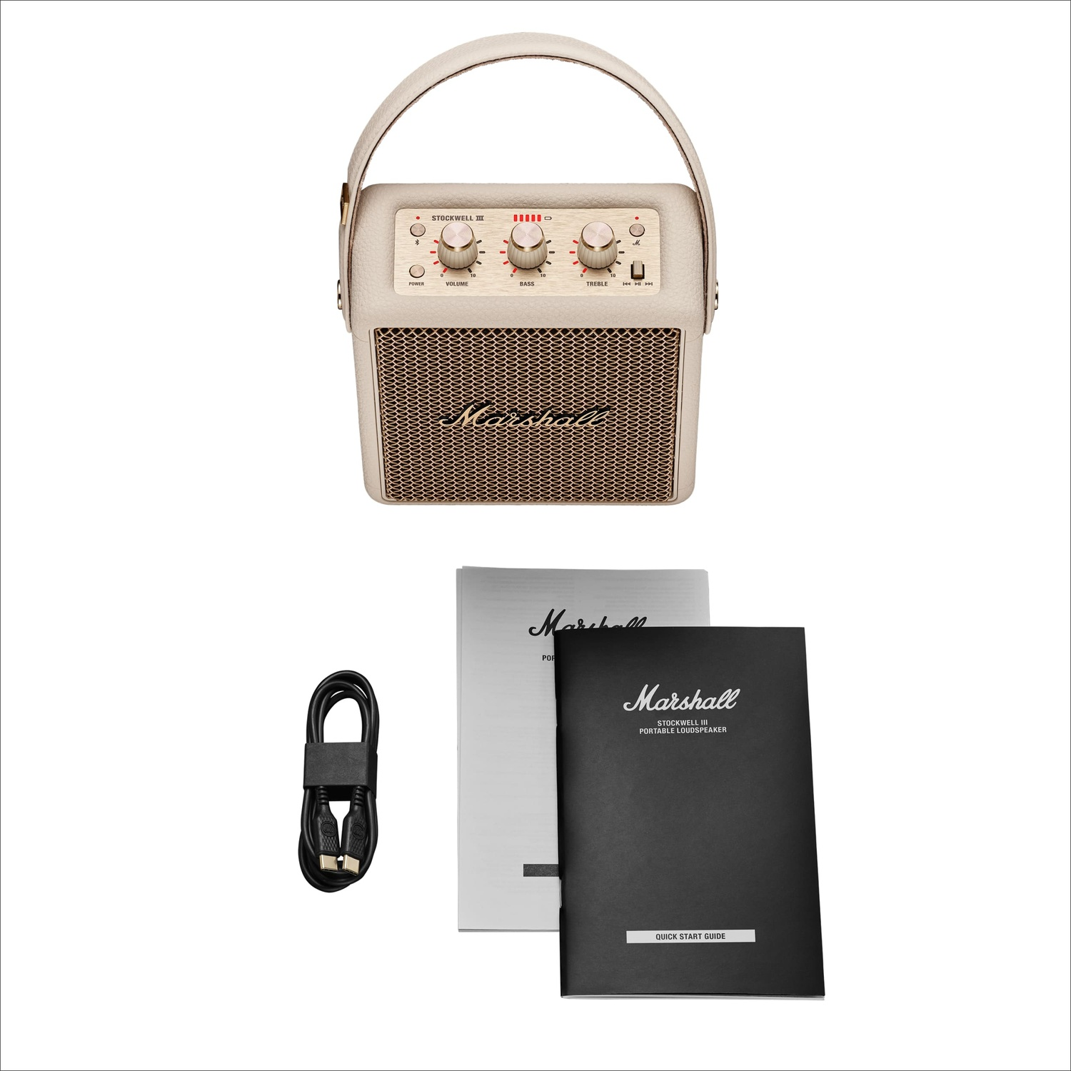A cream-colored Marshall Stockwell III speaker with a handle, a black USB cable, and instruction manuals.