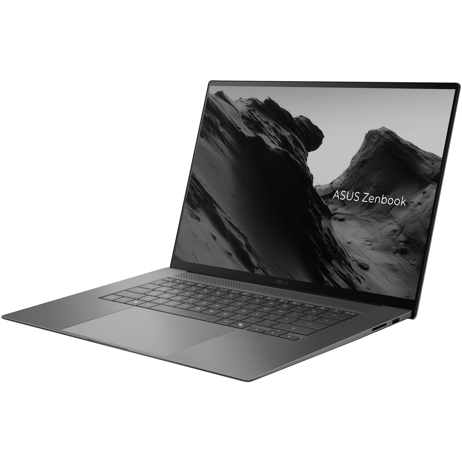 Een grijze Asus Zenbook laptop op een witte achtergrond met een bergenfoto op het scherm.