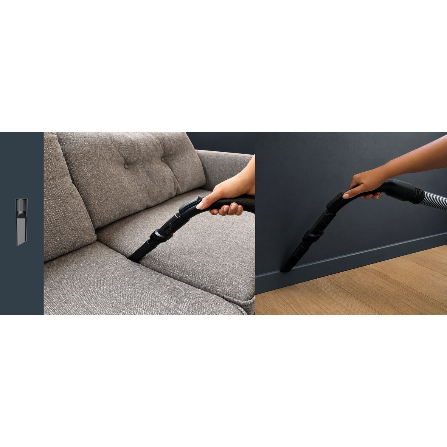 A hand uses a vacuum attachment to clean a gray sofa and a floor.
