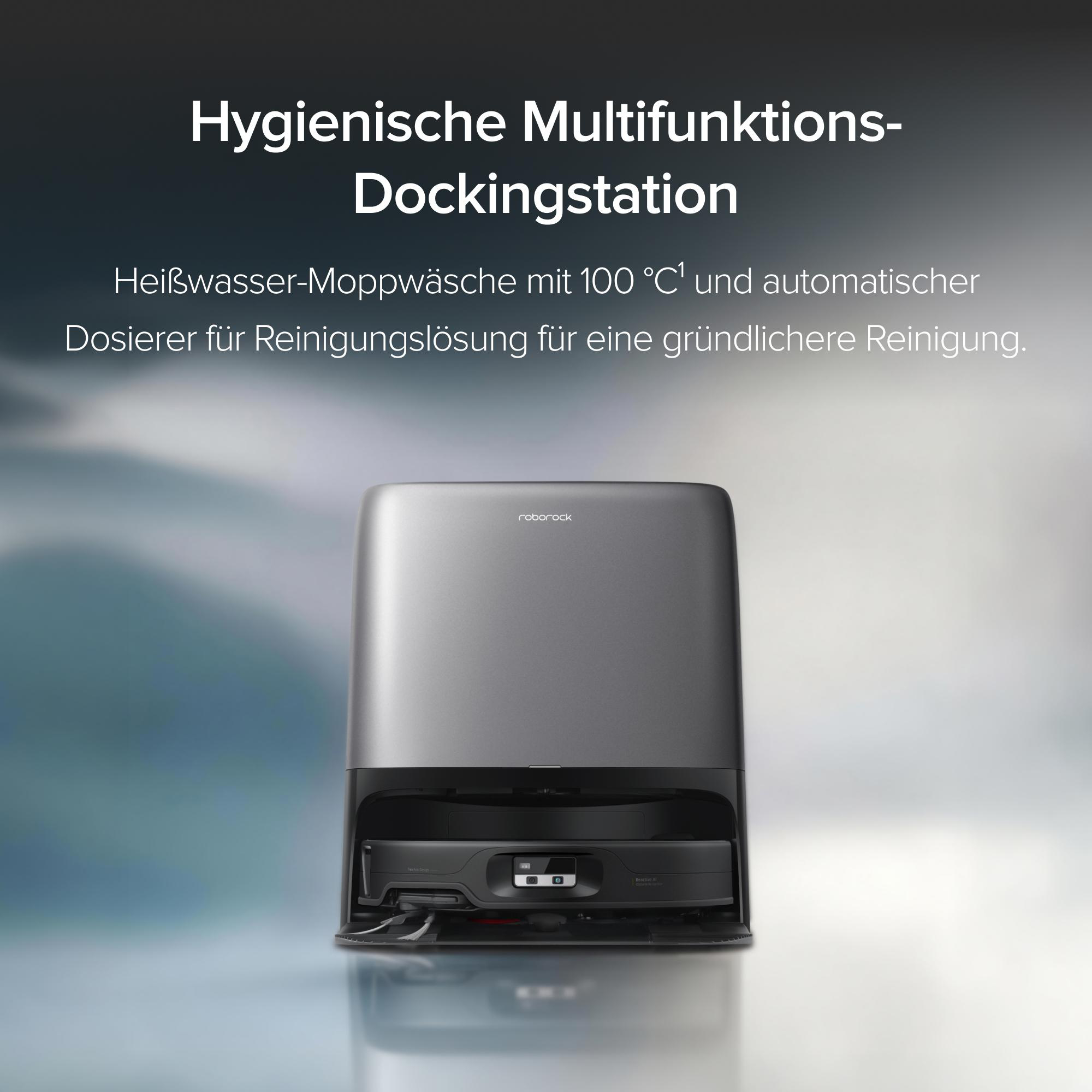 Graue Roborock-Dockingstation mit Roboterstaubsauger vor verschwommenem Hintergrund und deutschem Text.