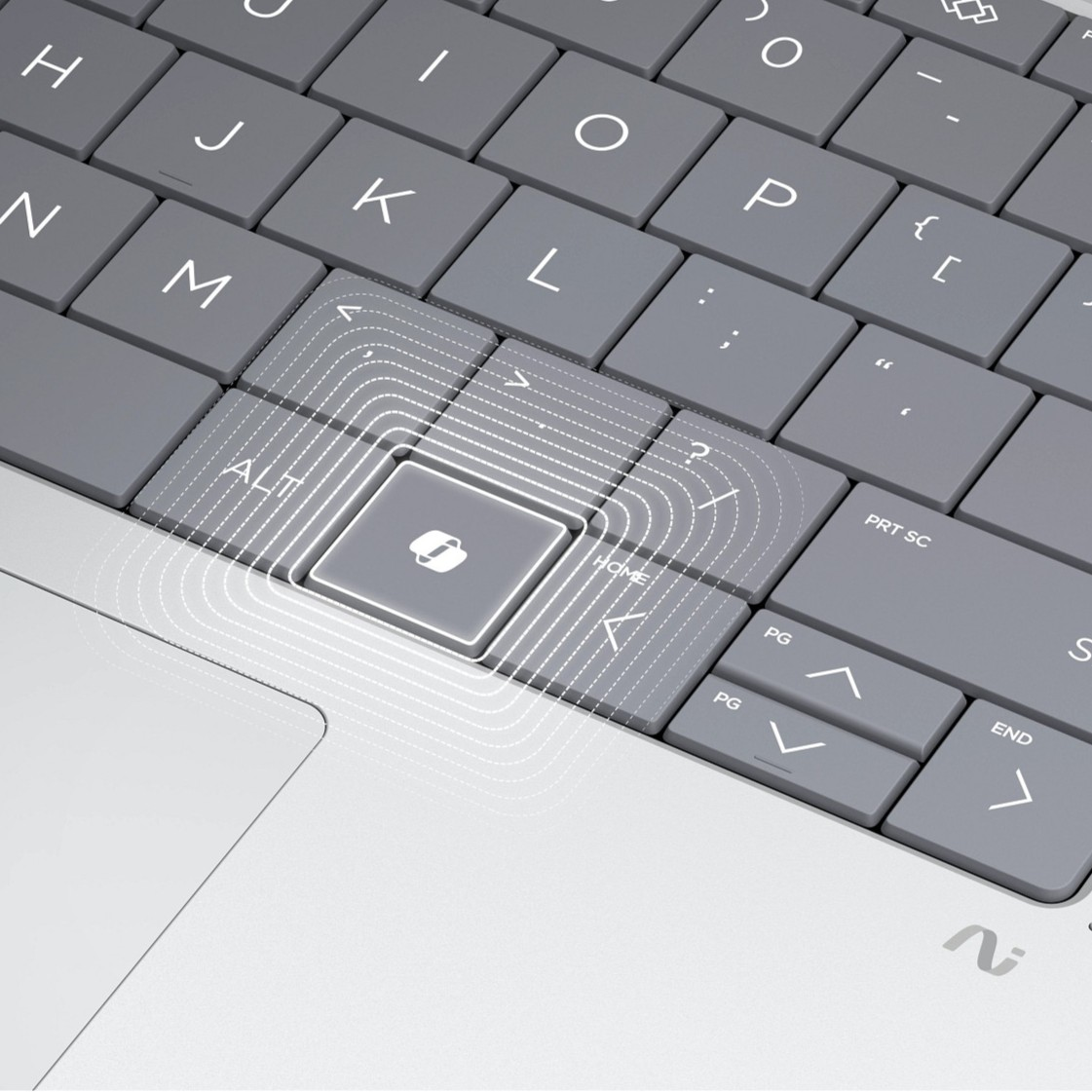 Primer plano de un teclado gris de portátil con líneas onduladas que emanan hacia afuera desde una tecla específica.